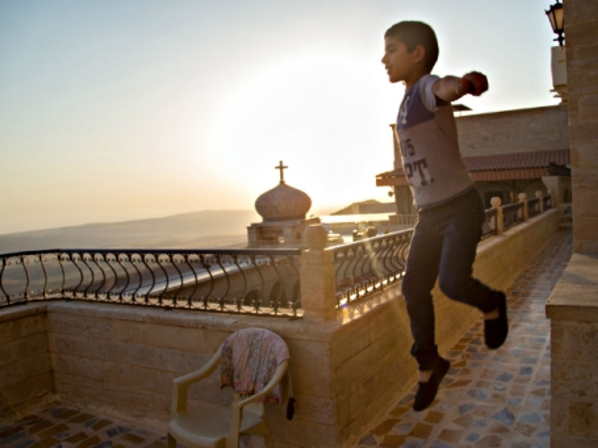 Kid playing inside Iraq's Mar Mattai monastery