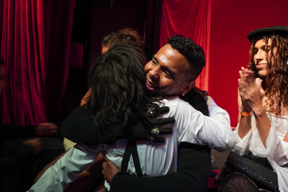 Klaud Guzmán hugs a friend after making it to the finals in the Vogue Femme category for the first time.