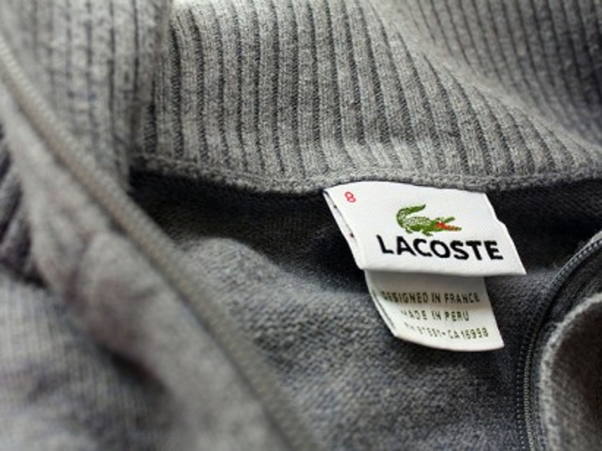 Lacoste, designed in France, made in Peru