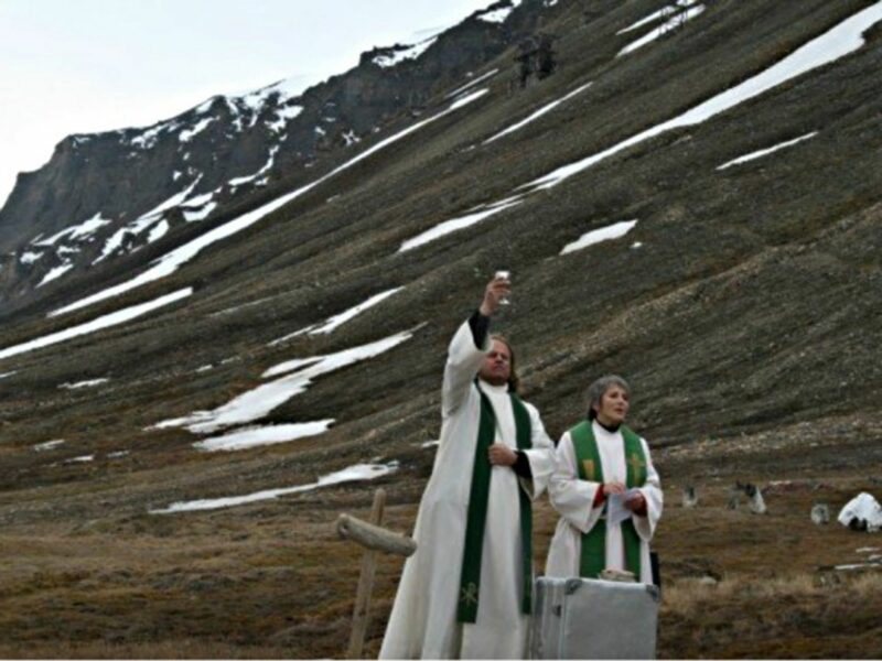 Leif Magne Helgesen (left) celebrating mass at the Longyearbyen 'cathedral'