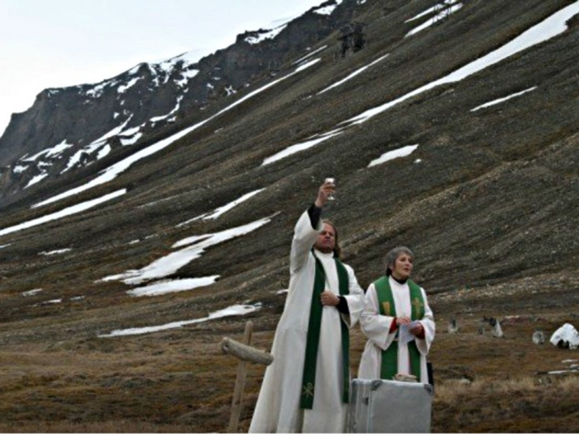Leif Magne Helgesen (left) celebrating mass at the Longyearbyen 'cathedral'