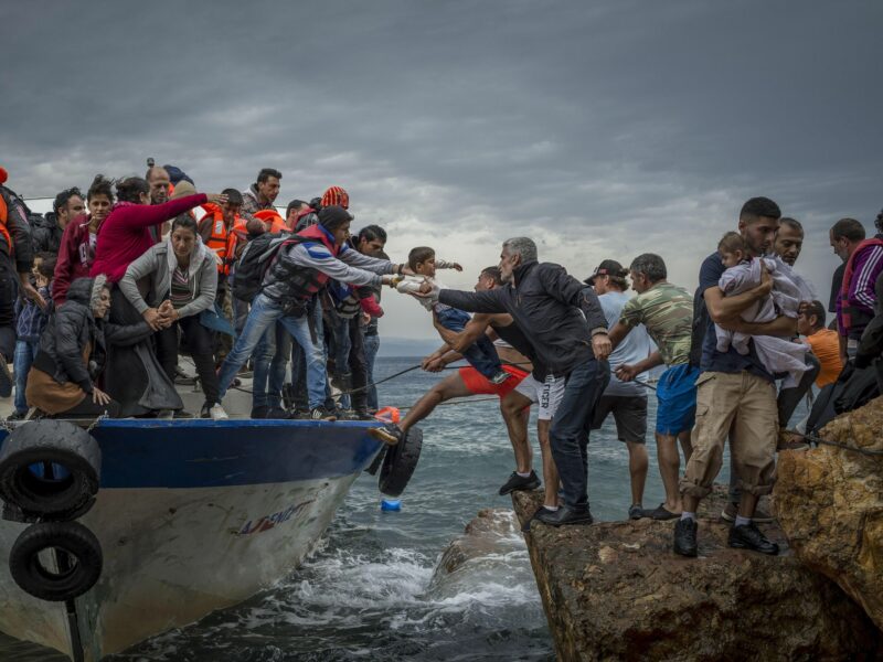 Lesbos Island, Greece - Refugees and Migrants aboard fishing boat