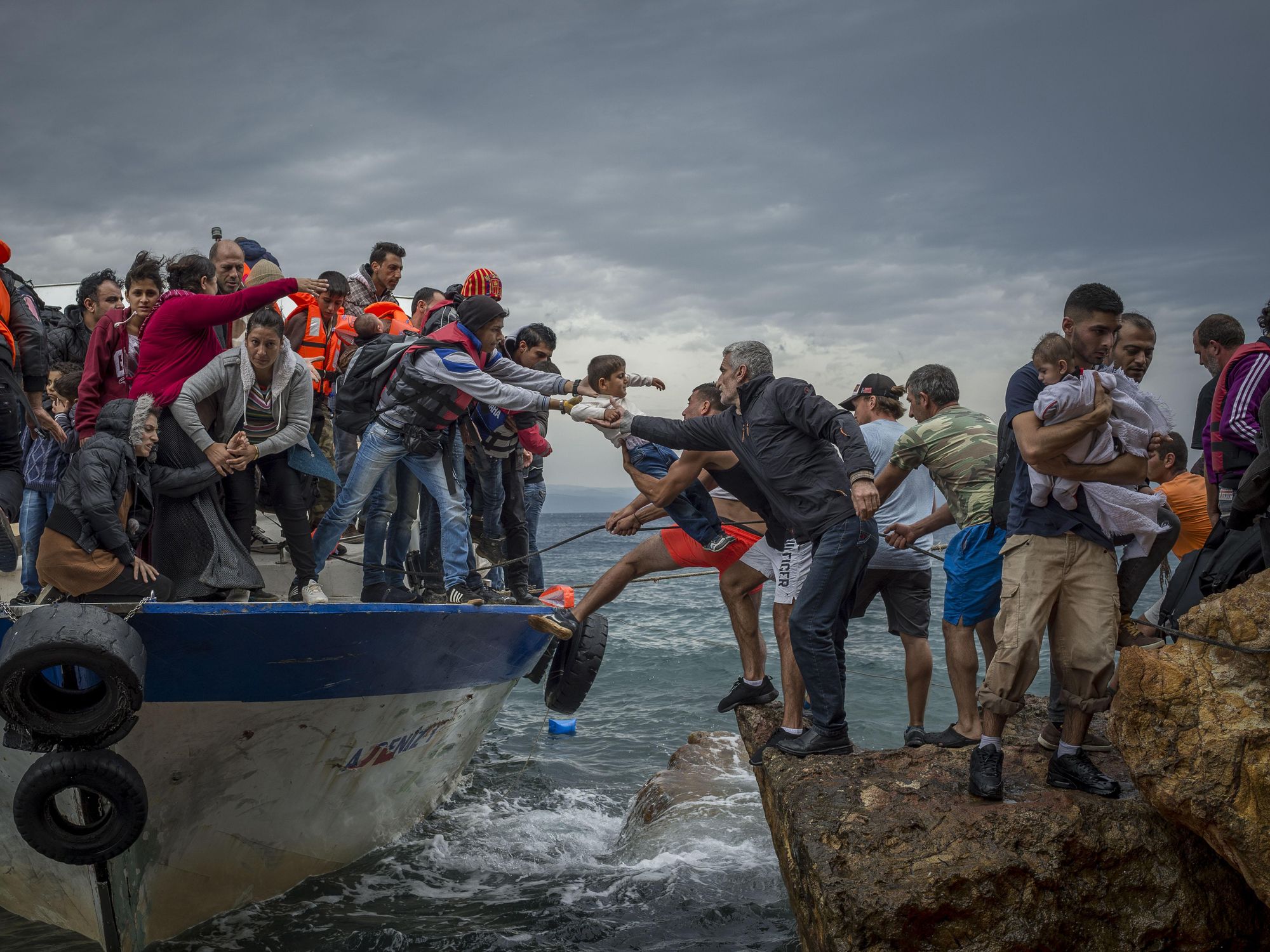 Lesbos Island, Greece - Refugees and Migrants aboard fishing boat