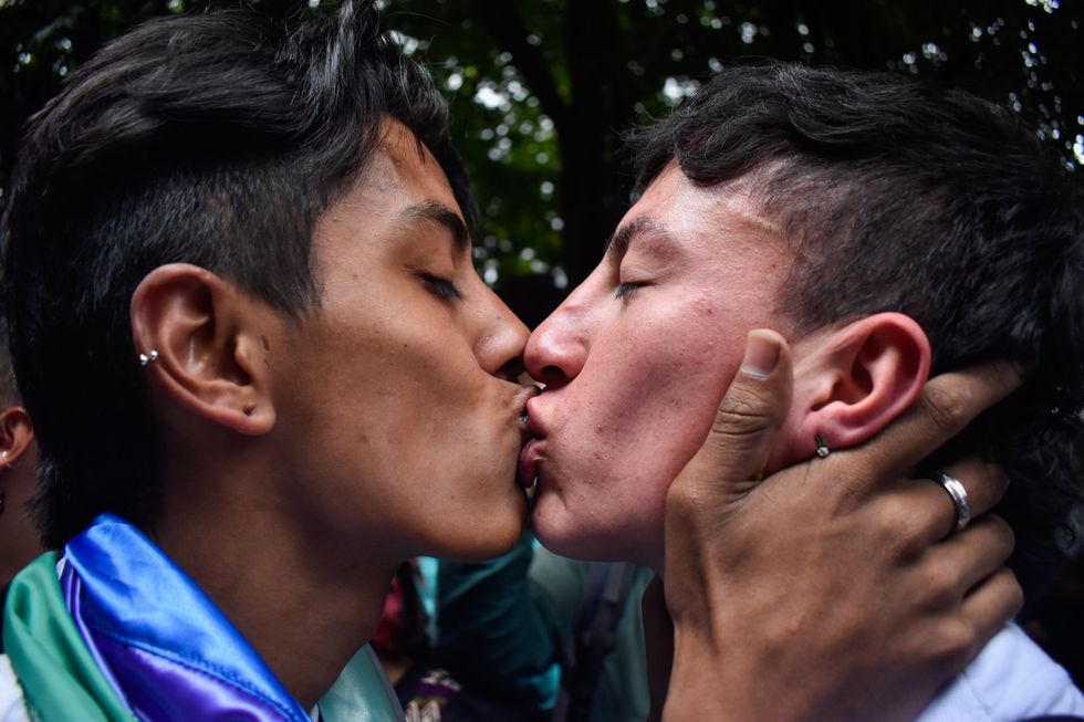LGTBIQ+ Demonstrators kiss during a LGTBIQ+ rights protest in Bogota, Colombia.