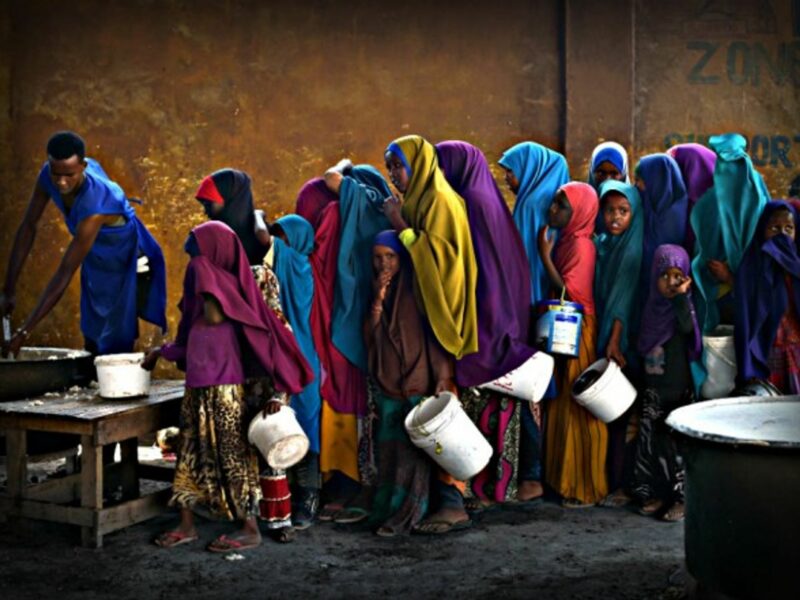 Lining up for food in Somalia, where they are experiencing a severe drought .