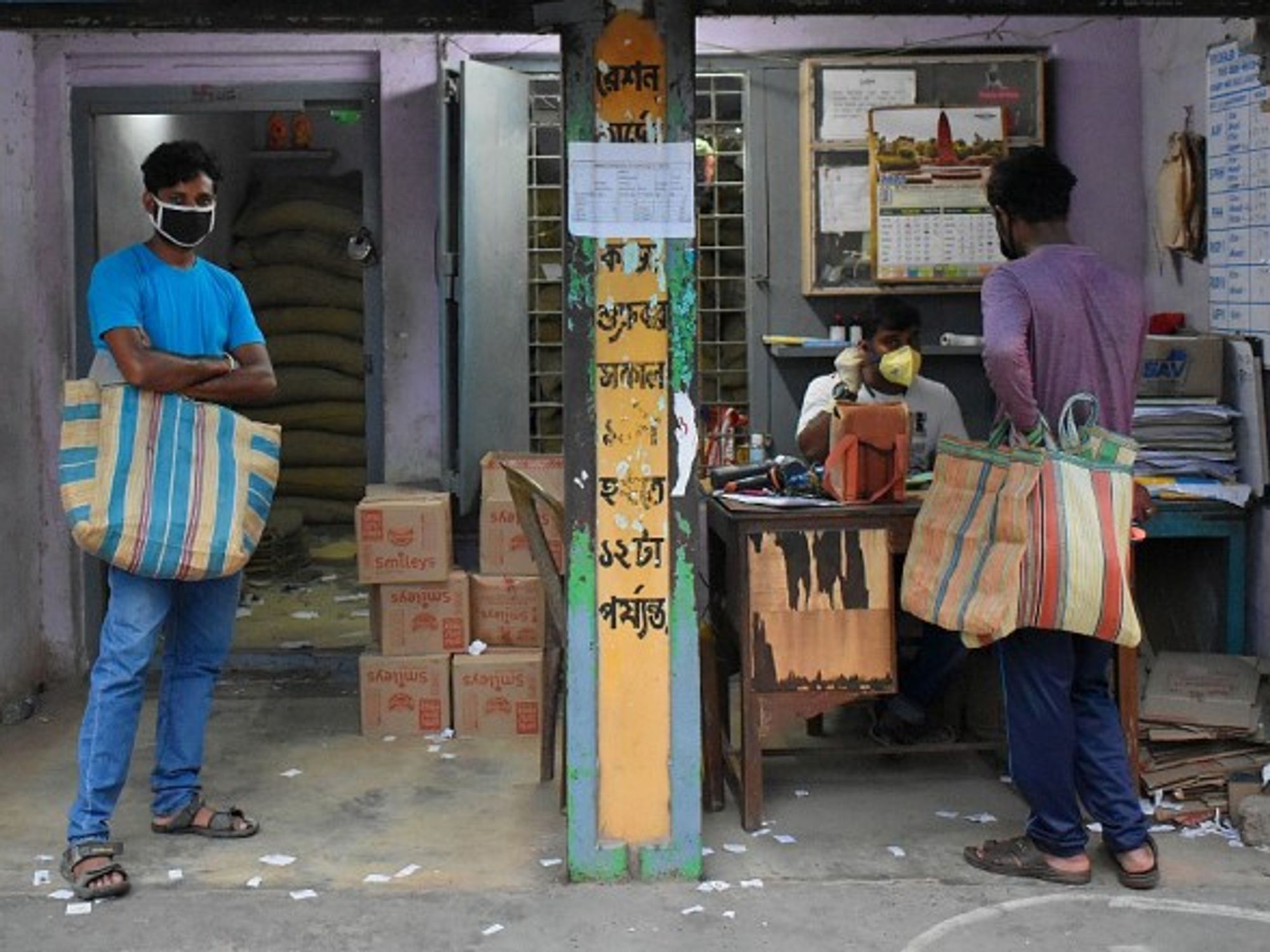 Lining up for rice rations in Kolkata.