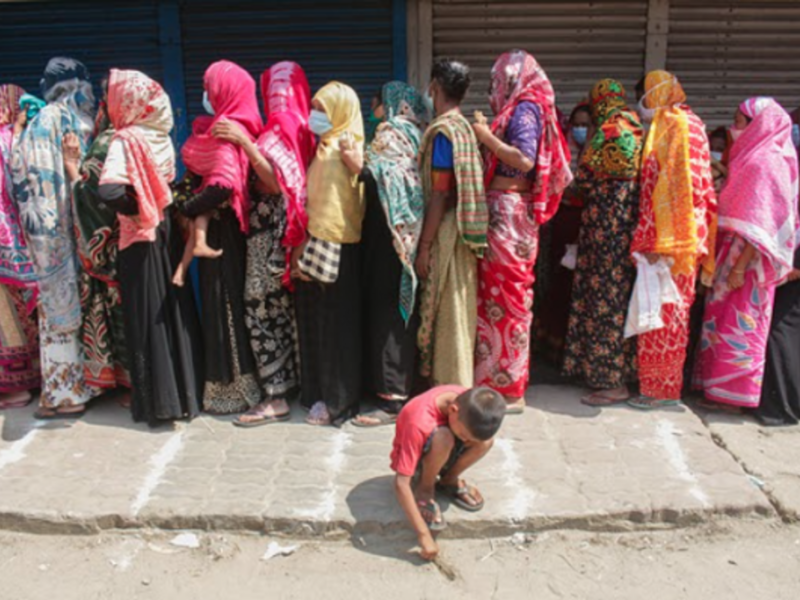 Lining up to buy rice and flour in Sylhet, Bangladesh as the country starts a 7-day lockdown.