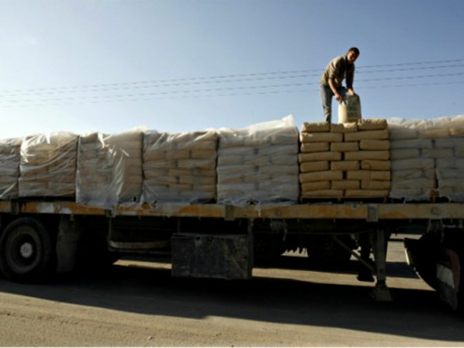 Loading cement on a truck in Rafah