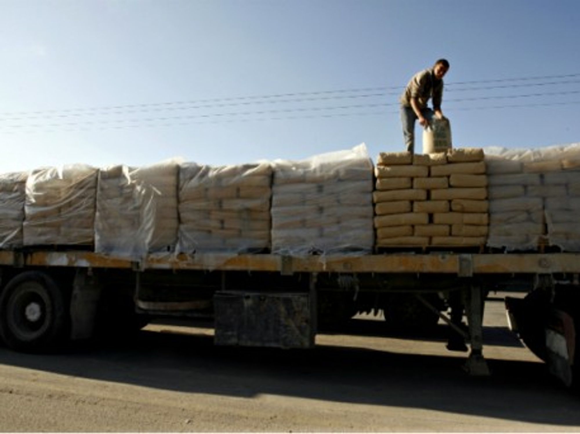 Loading cement on a truck in Rafah