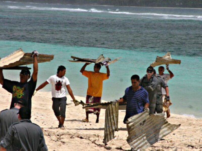 Local volunteers cleaning up debris in Samoa.