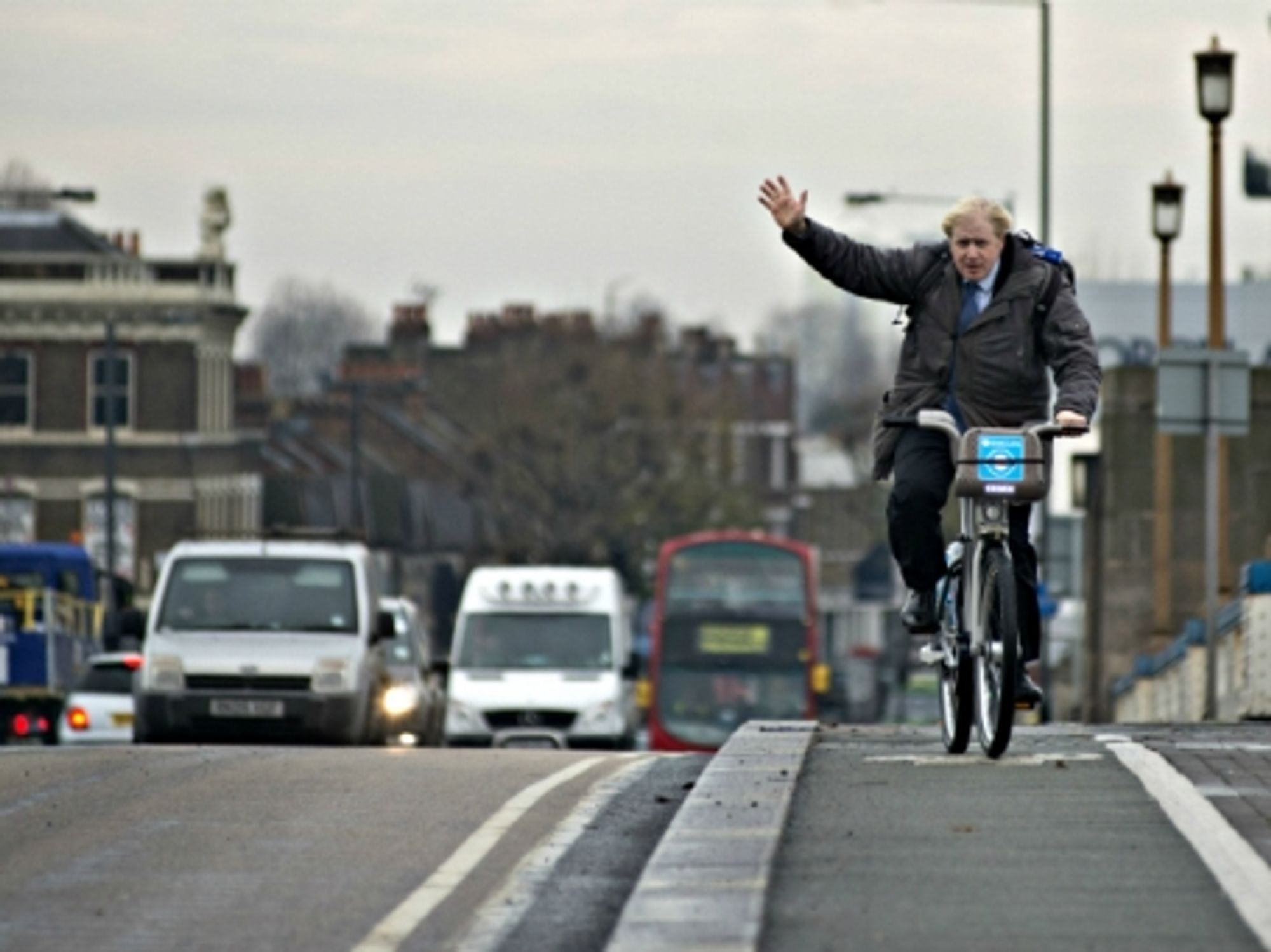 London Mayor Boris Johnson cycling in the city