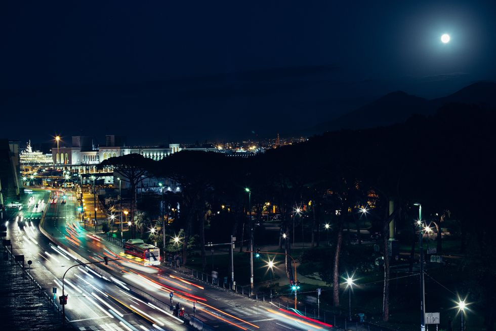 Long exposure photo of cars driving by in Naples, by night