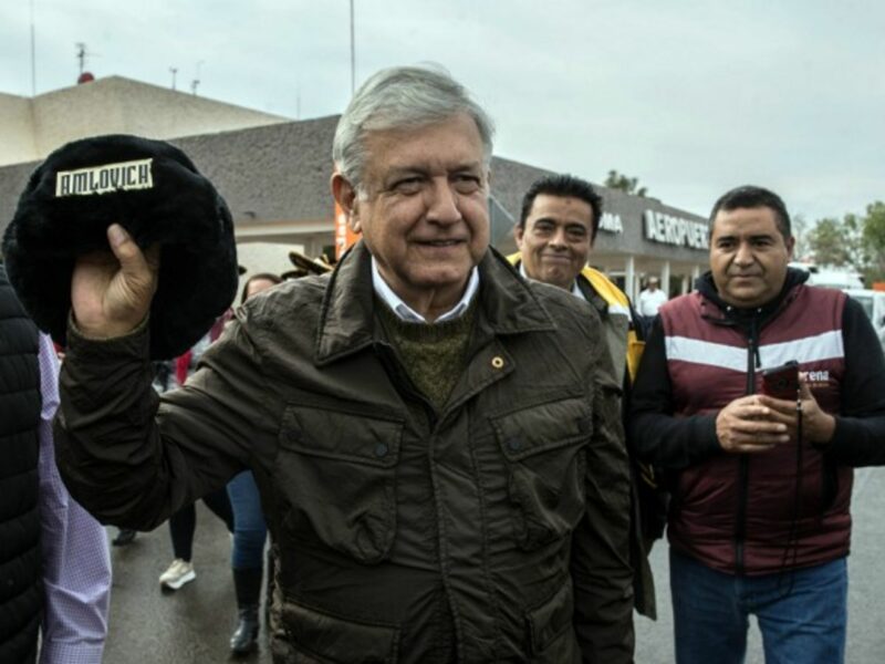 López Obrador holding a traditional Russian hat