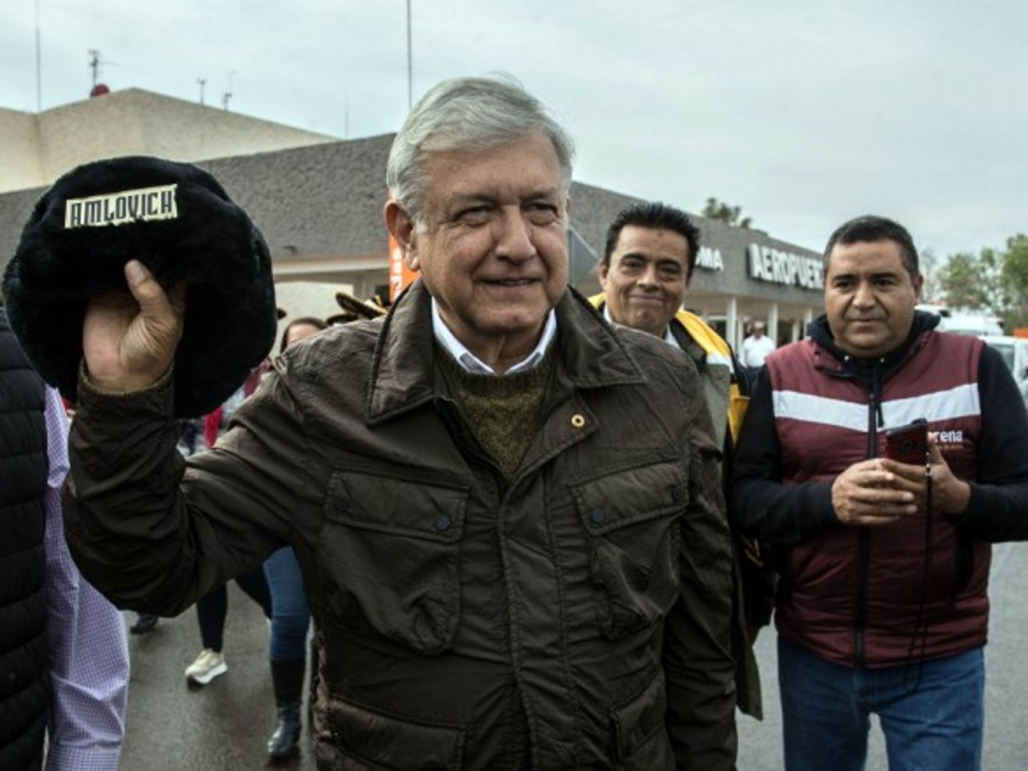 López Obrador holding a traditional Russian hat