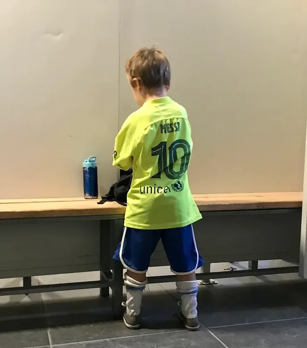 Lorenzo in the locker room of the training school.