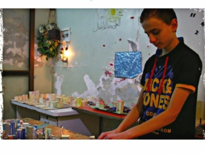 Making touch to his model (post-war) city of the future.