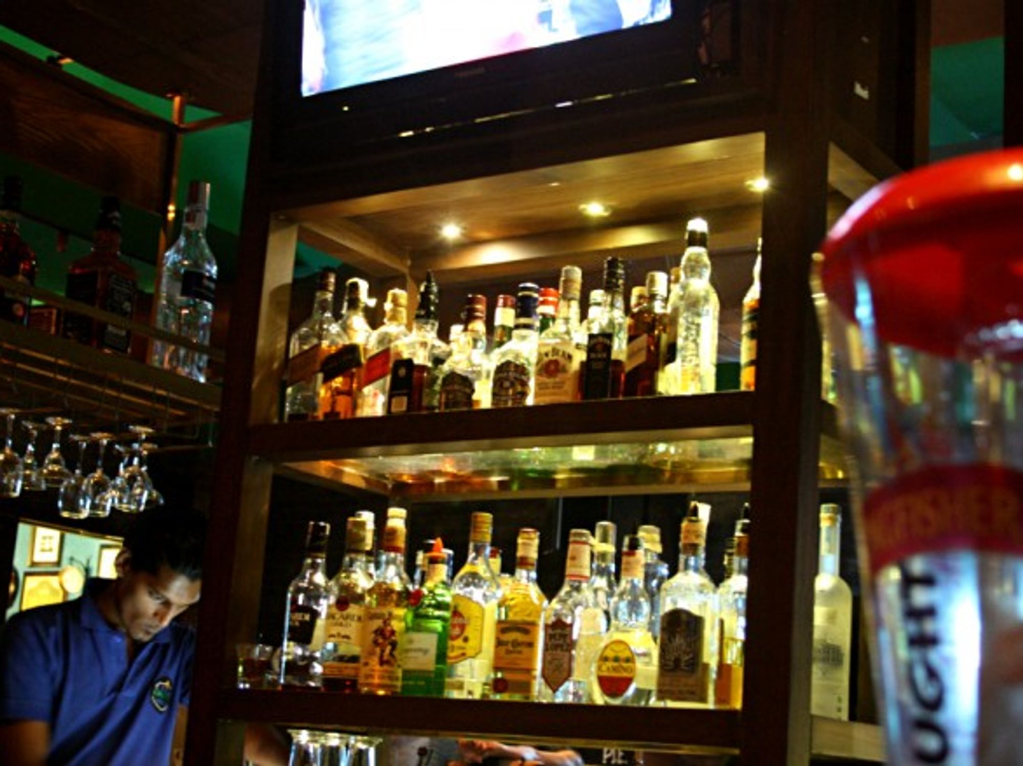 Man bartending at a famous pub in South Mumbai