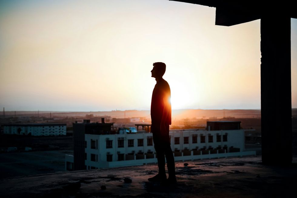 Man dramatically staring off into the distance
