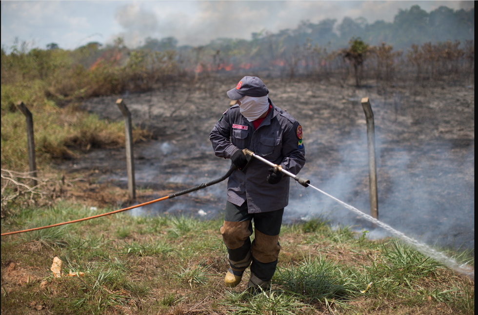 Man putting out fire