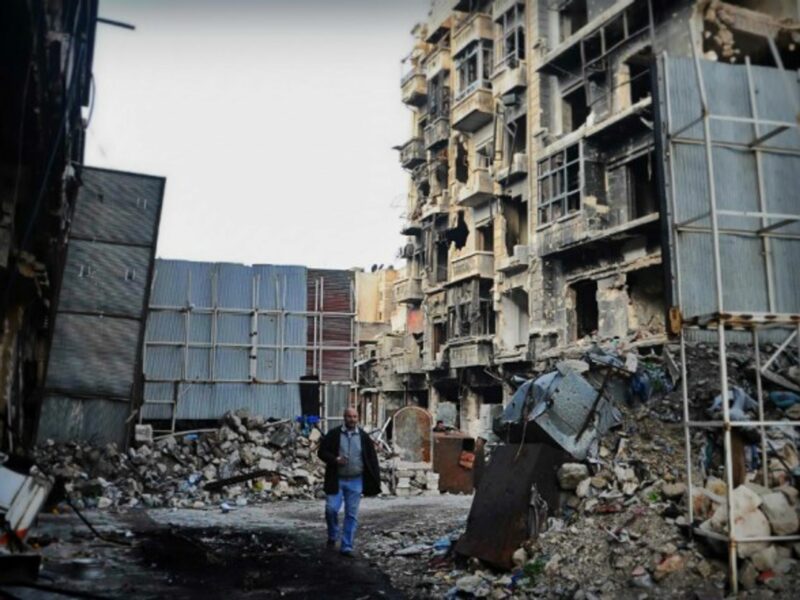 Man walking in Aleppo on Dec. 17