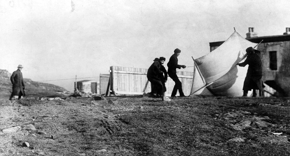 Marconi watching associates raising the kite (a "Levitor" by Baden Baden-Powell) used to lift the antenna at St. John's, Newfoundland, December 1901