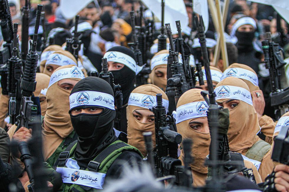 Masked Palestinian gunmen from the Al-Aqsa Martyrs Brigades of the Fatah movement led by President Mahmoud Abbas, appear carrying their weapons during the demonstration for the Palestinians who were shot dead by the Israeli army this year, in Balata refugee camp, east of Nablus, in the occupied West Bank.