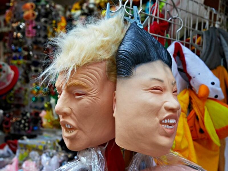 Masks of Donald Trump and Kim Jong Un hanging in a shop in Hong Kong