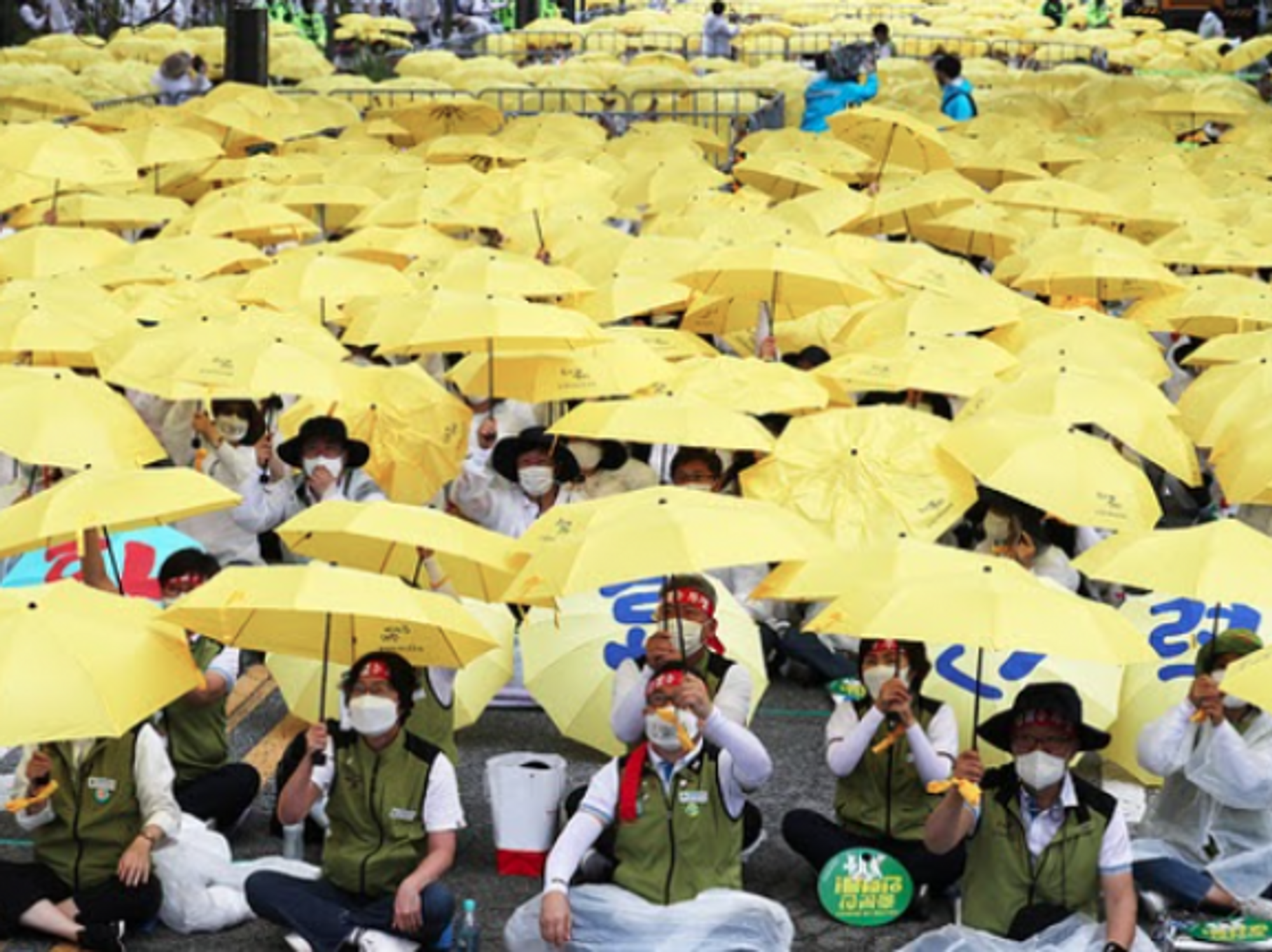 Medical workers rally in Sejong, South Korea, calling for an expansion of public medical services and measures to curb illegal medical treatment.