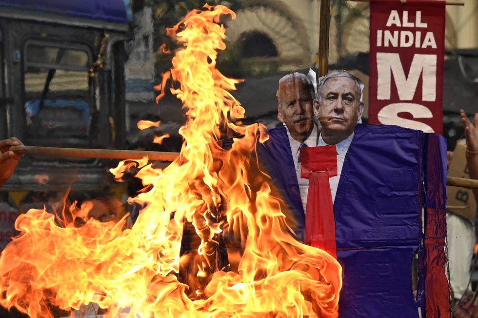 Members of Socialist Unity Centre of India C hold a pro-Palestine demonstration and burn an effigy of US President Joe Biden and Israel Prime minister Benjamin Netanyahu over attack on Gaza Strip