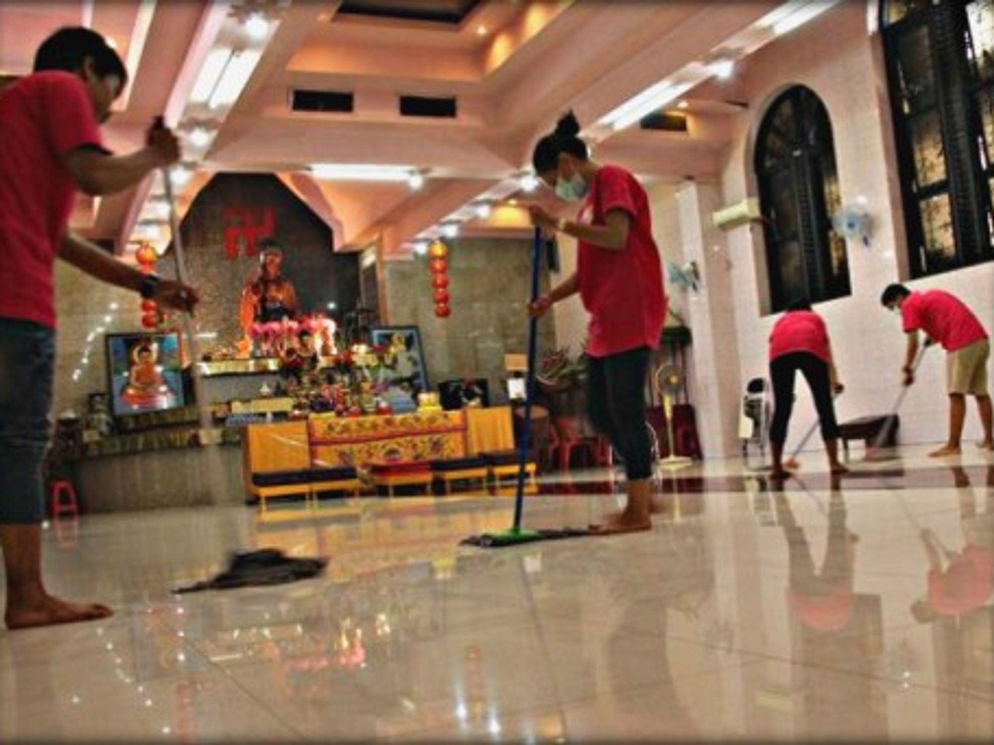 Members of the berhati group cleaning up a Vihara in Jakarta.