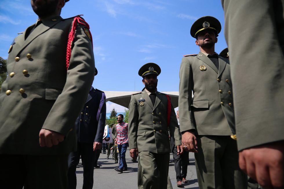 Members of the Iranian Army are leaving Friday prayer in front of the main entrance of Tehran University during an anti-Israel rally in Tehran.