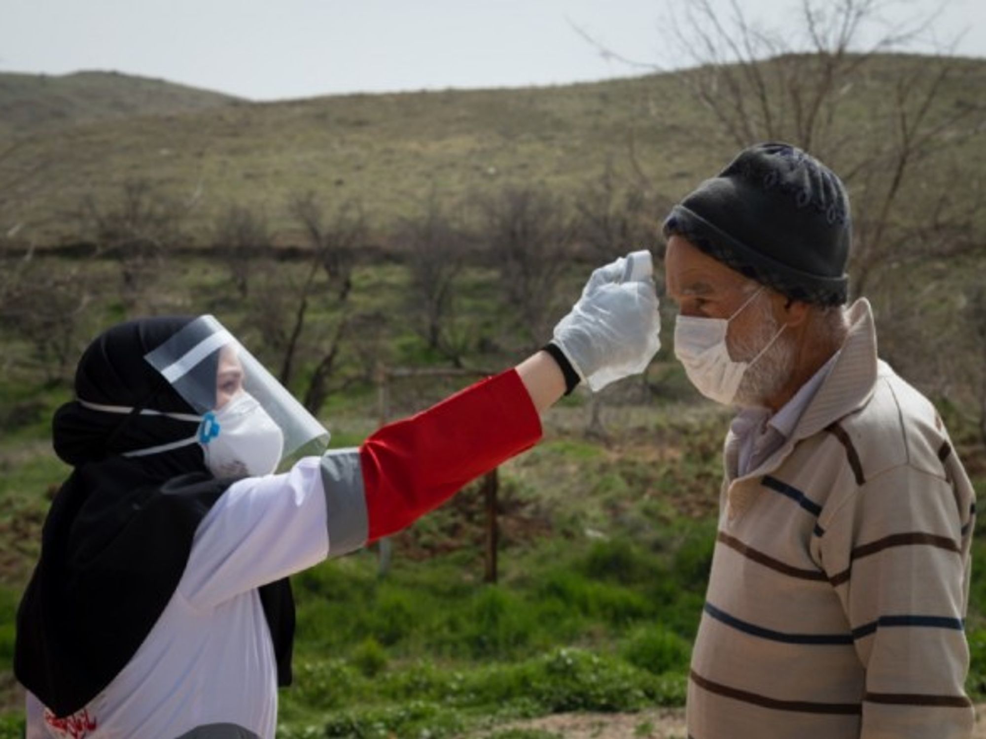Members of the Iranian Red Crescent's Volunteers Organization in the Hameh Sin mountain village in Eastern Tehran, Iran, sanitizing and screening villagers who may be infected by coronavirus.