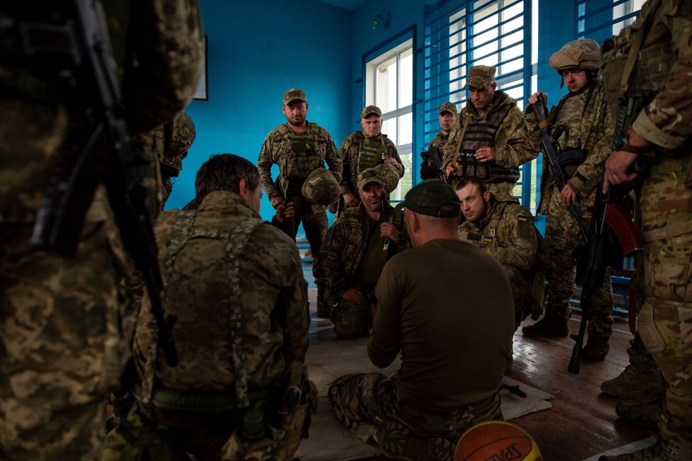 Members of the Kyiv Territorial Defense receive combat training after being deployed in the Donbas.