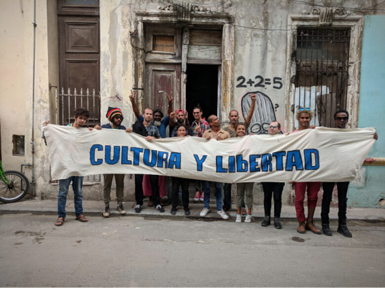 Members of the San Isidro movement hold up a banner reading 'Culture and Liberty'