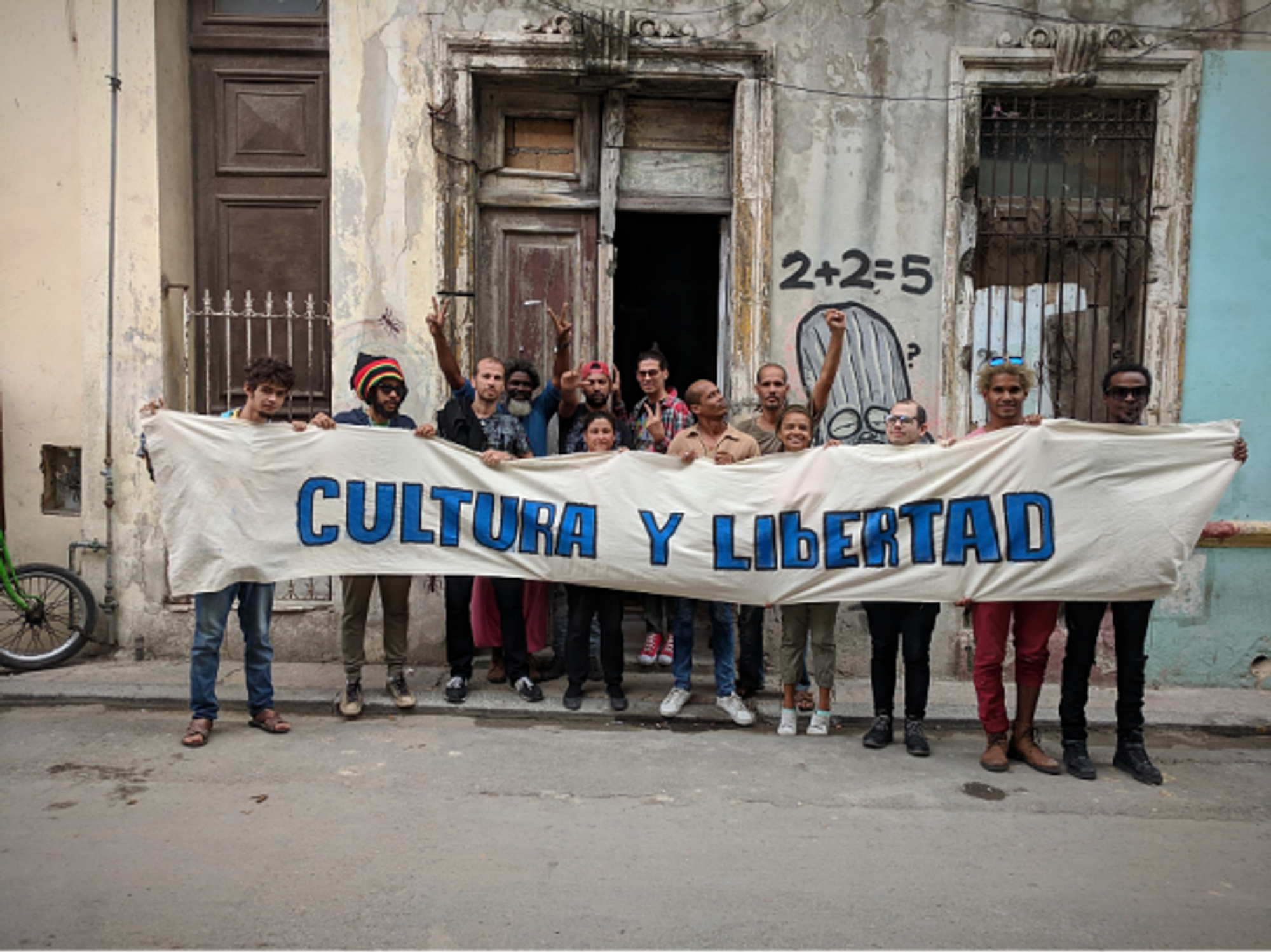 Members of the San Isidro movement hold up a banner reading 'Culture and Liberty'