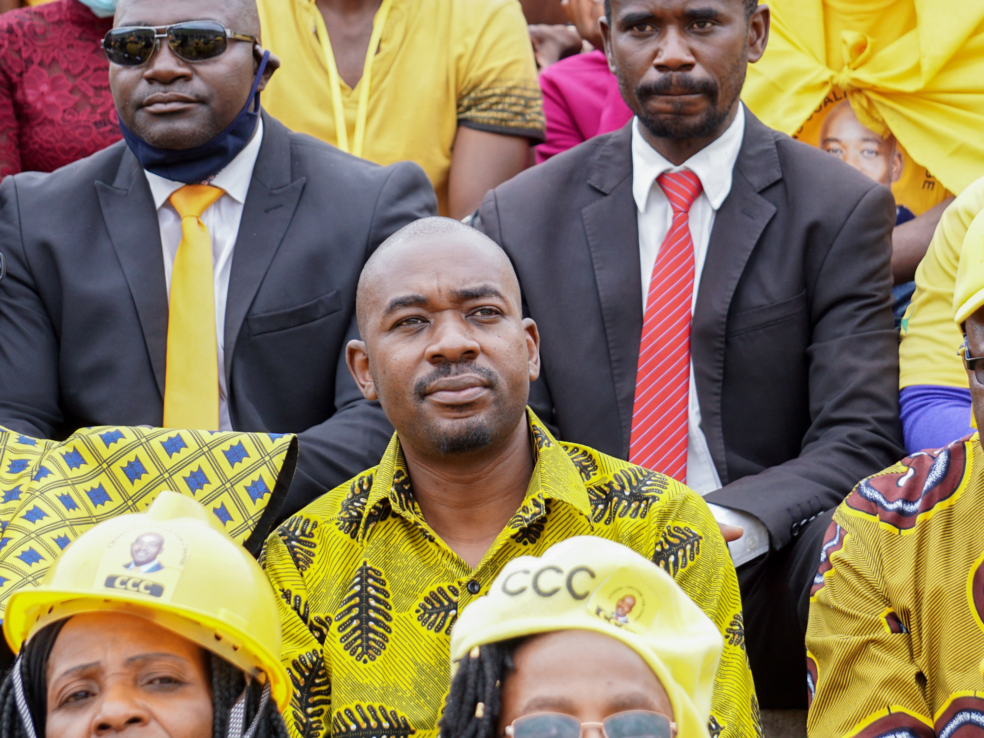 men standing in a crowd