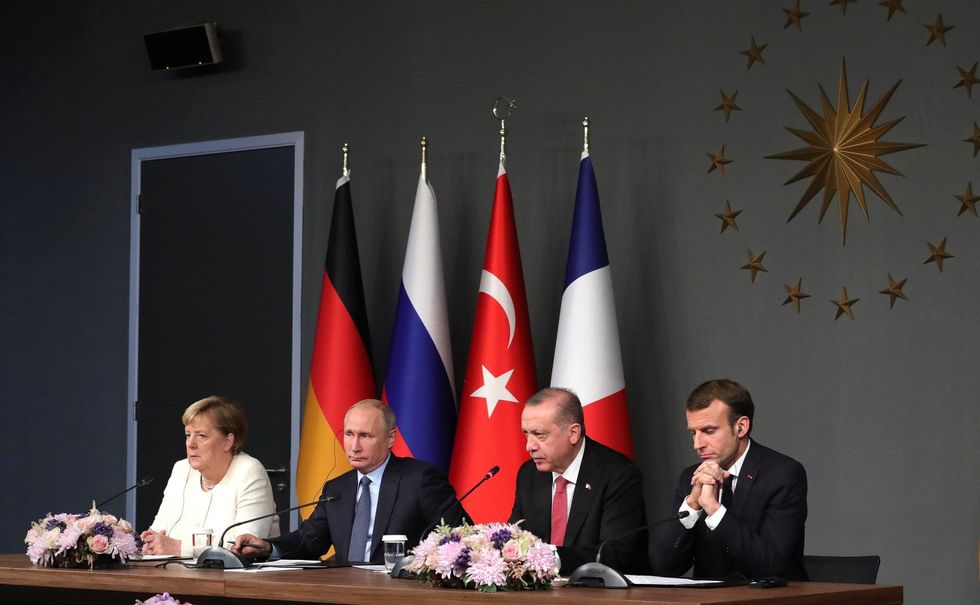 Merkel, Putin, Erdogan and Macron during a joint press release in Istanbul, Turkey