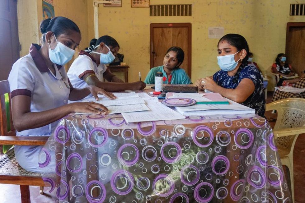 Midwives write prescriptions for pregnant women at Primary Medical Care Unit in Jaffna, Sri Lanka.