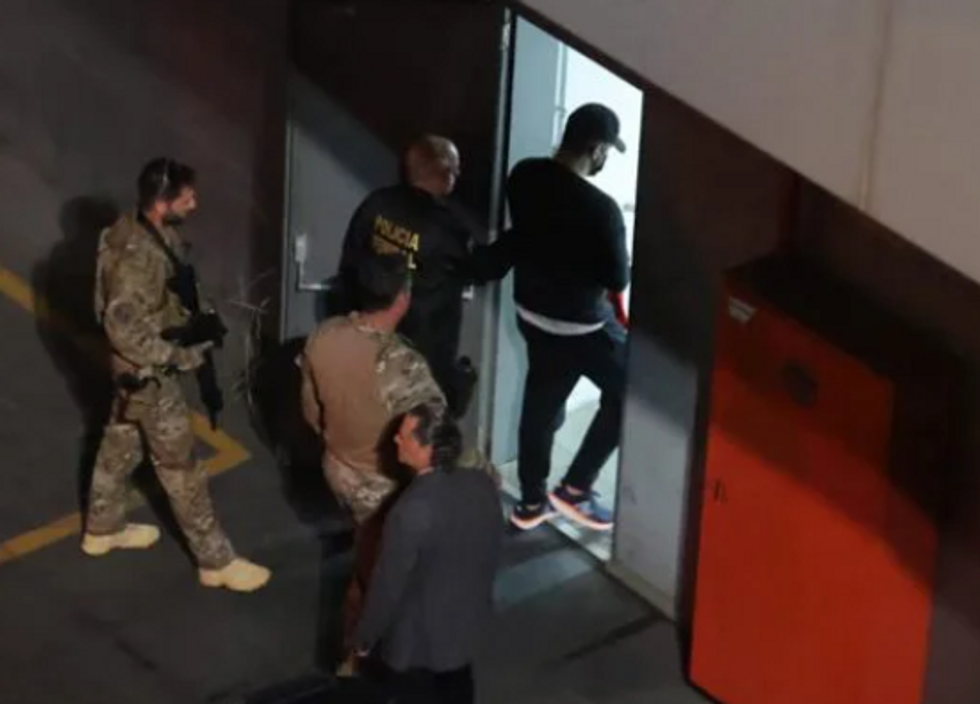 Miliatary and Police officers arresting Thiago Brennand, Brazilian businessman.