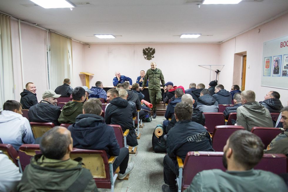 Mobilized men gather in a military commissariat in Irkutsk.