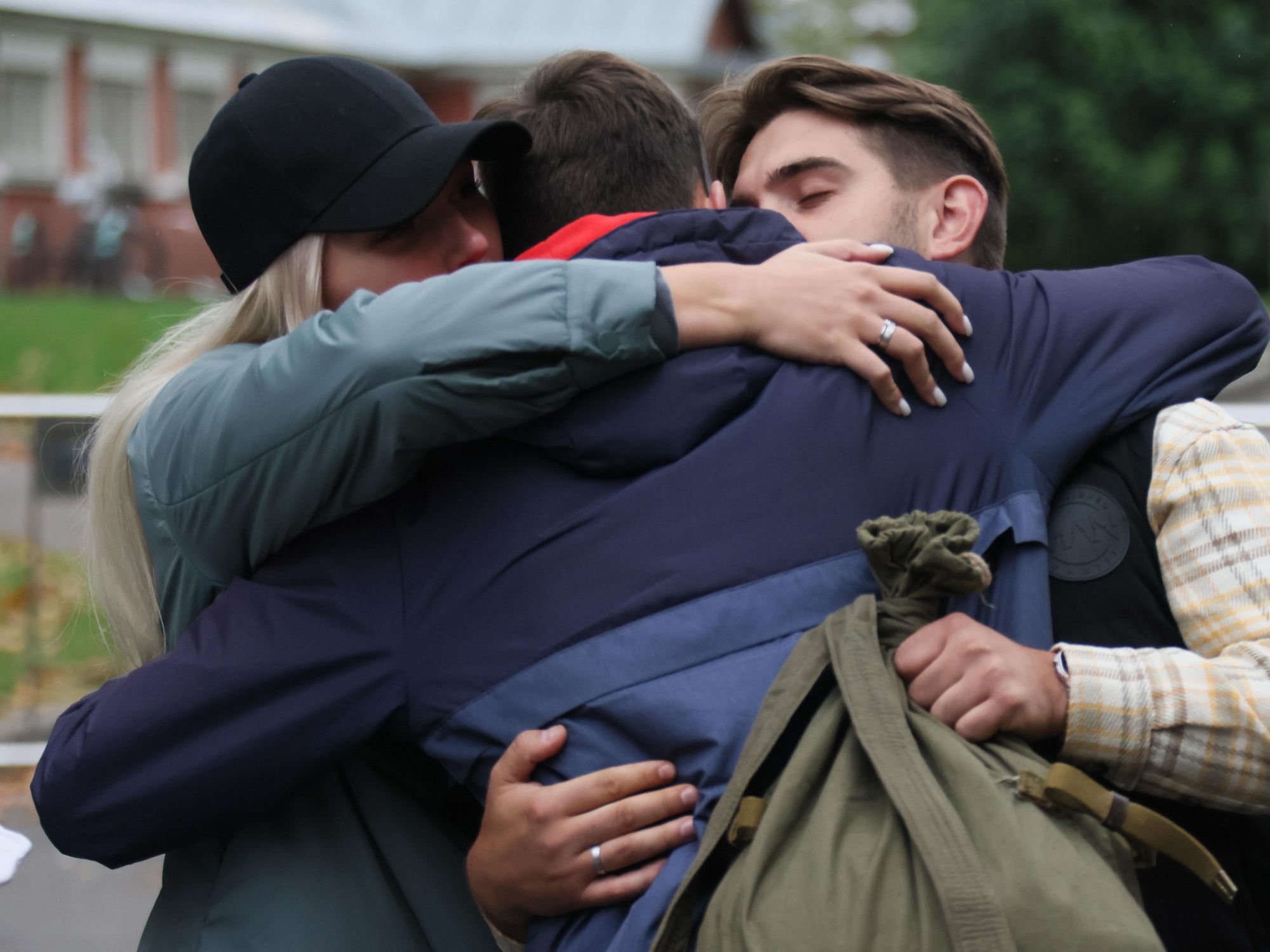 Mobilized men say goodbye to their families​ at a station in Moscow