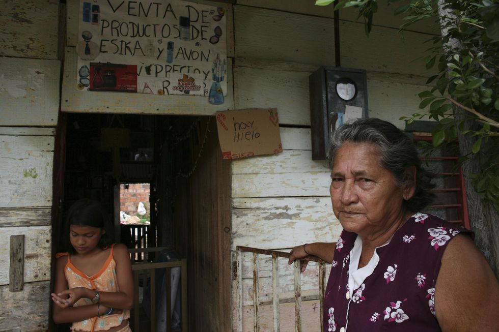 Modest shop made of found or recycled wood in a Colombian slum