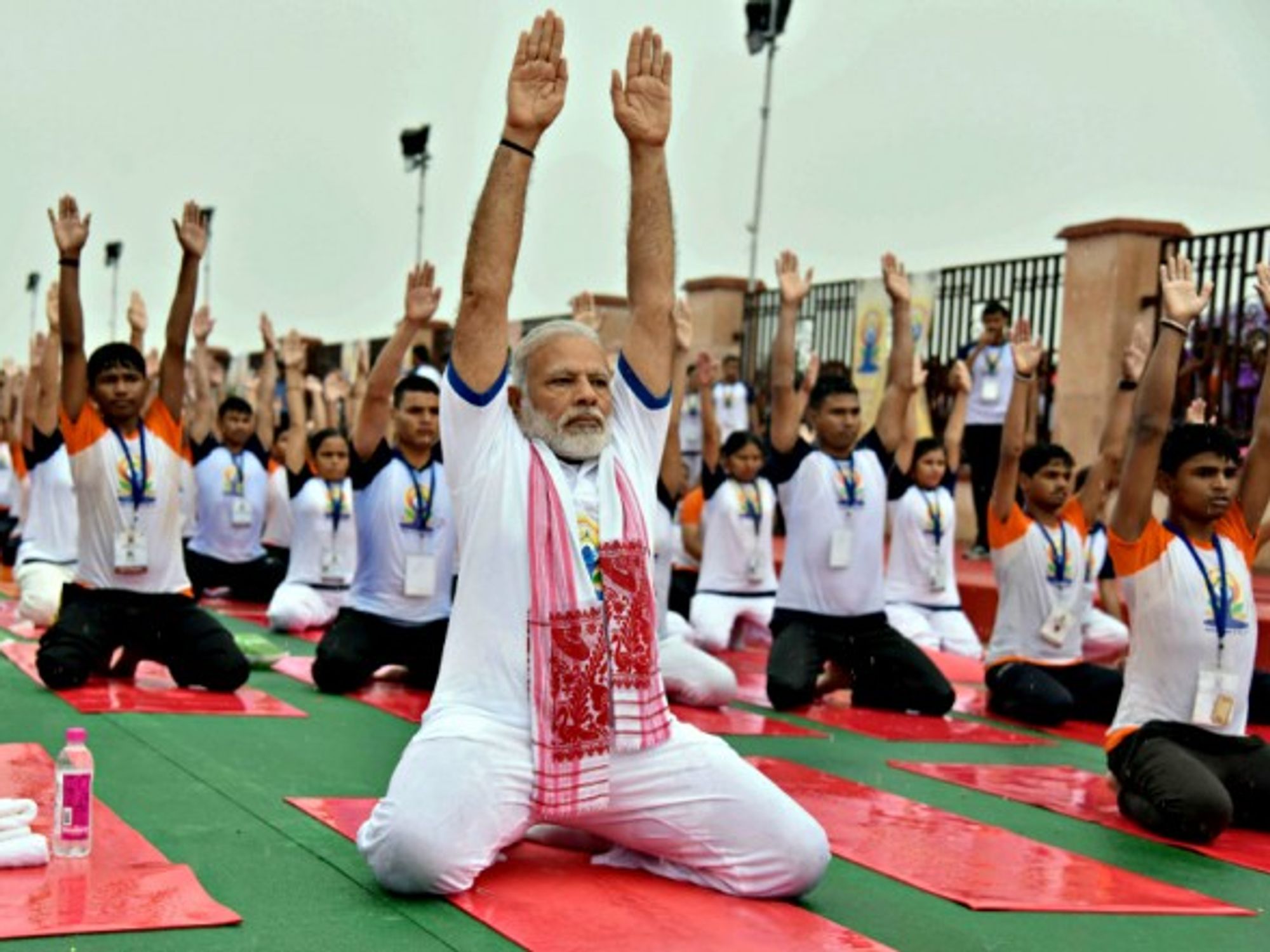 Modi participating in a mass yoga demonstration in Lucknow