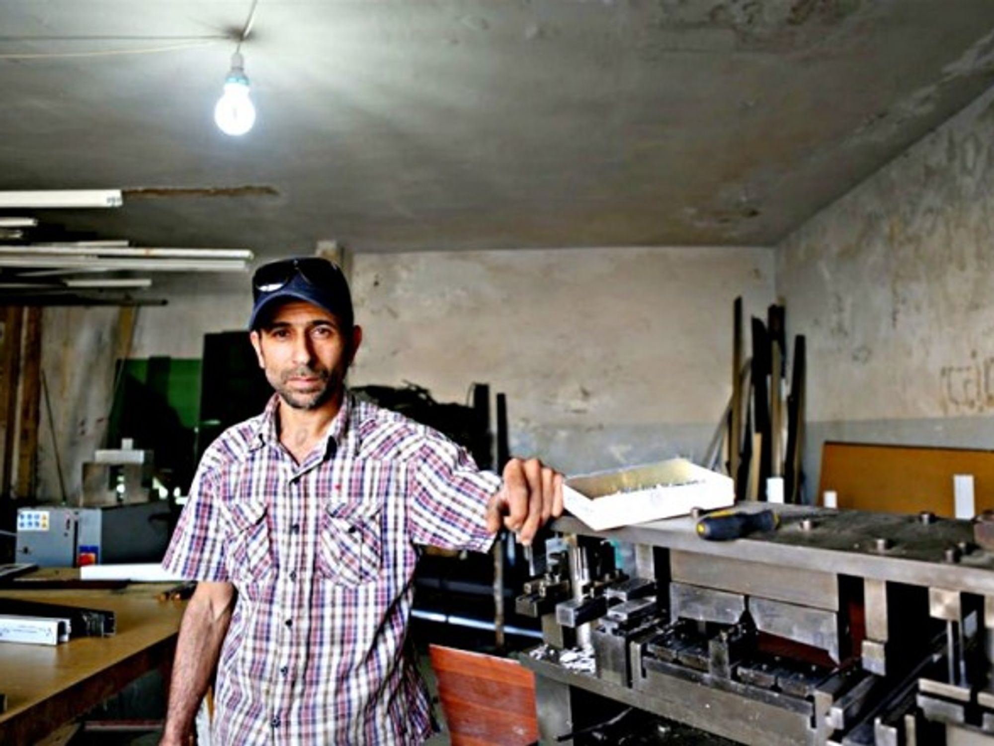 Mohammad Azaqeer of Syria, now lives in Lebanon working as an aluminum presser