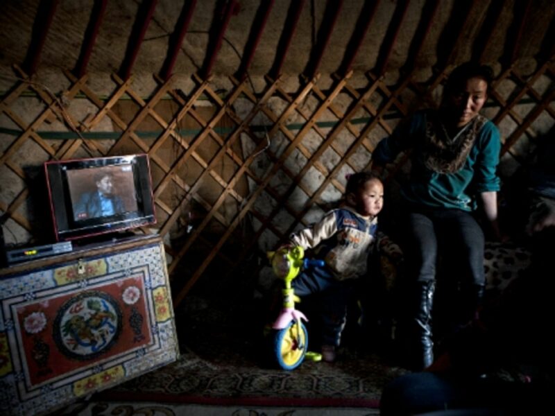 Mongolian family inside a traditional ger (yurt) in the Gobi desert