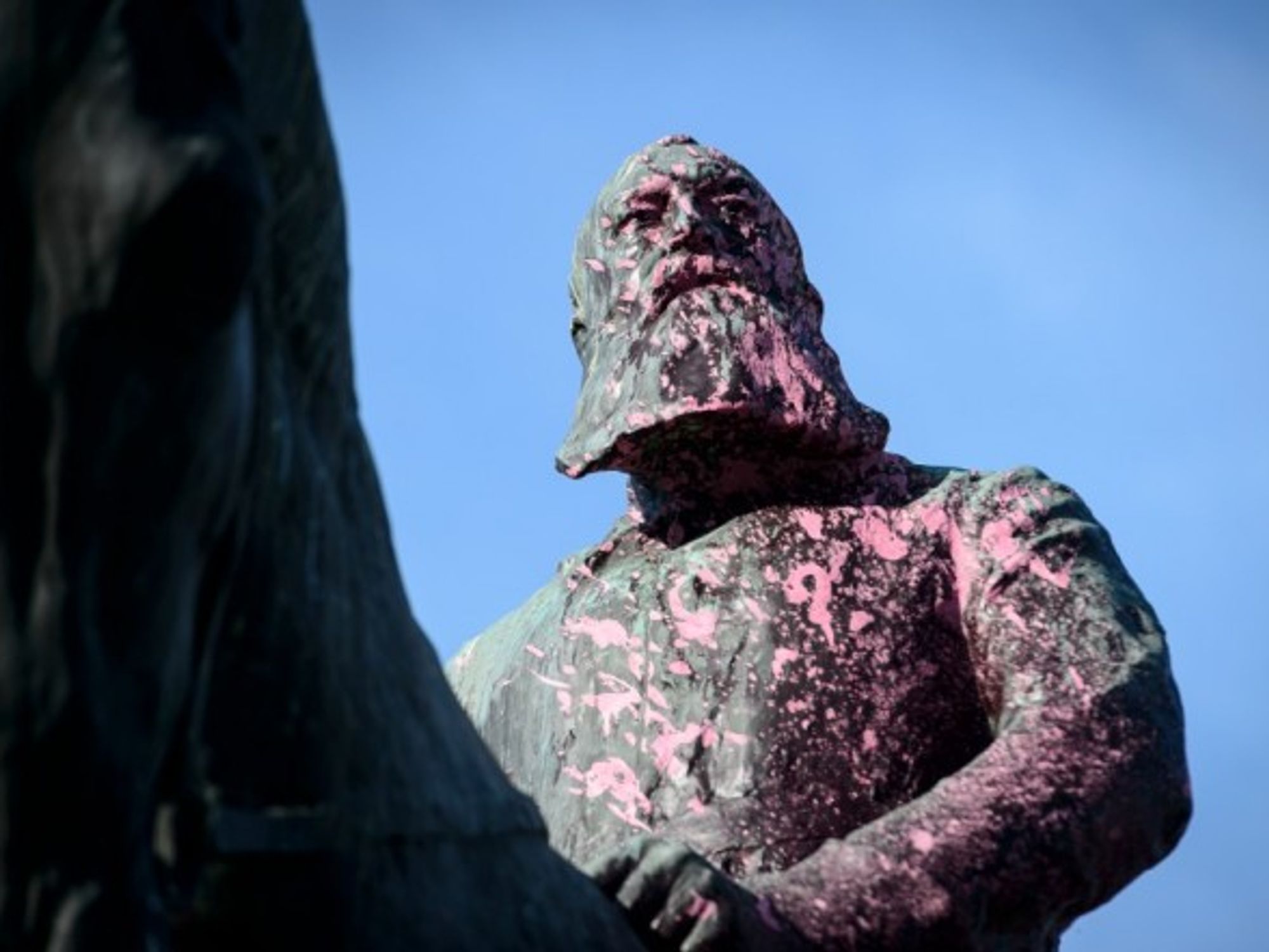 Monument of King Leopold II in Brussels paintbombed with pink paintin 2018.