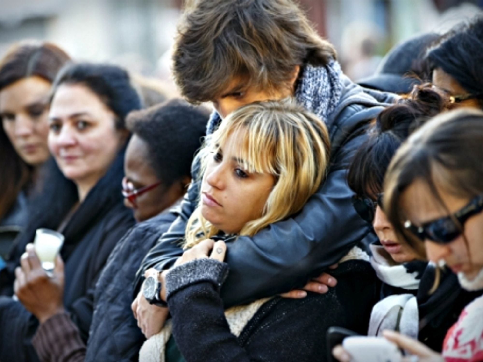 Mourners near Paris' Bataclan concert venue on Nov. 15
