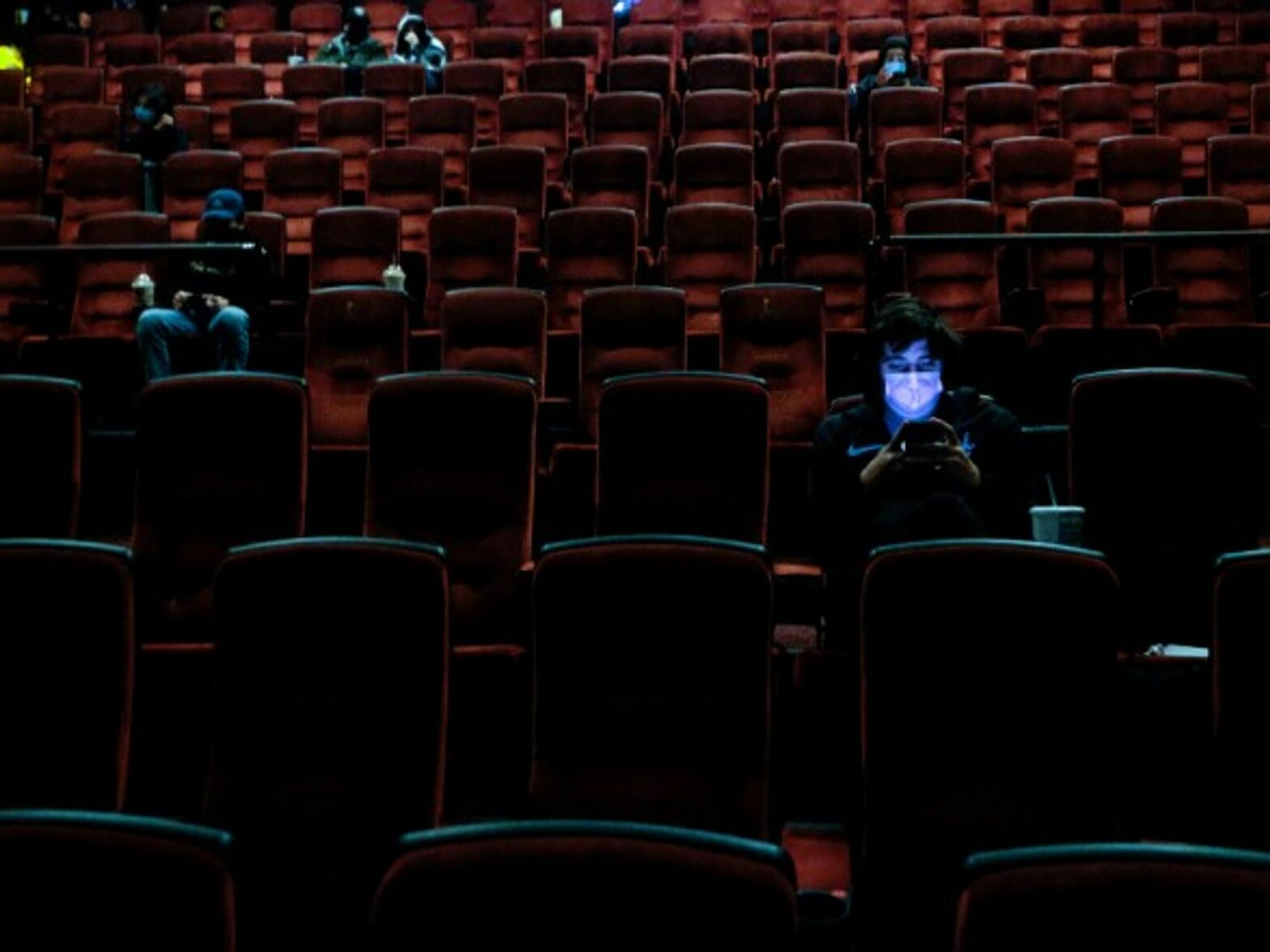 Moviegoers at the AMC Theater on the first day of reopening for theaters which had been closed due to the COVID-19 pandemic in Burbank, California