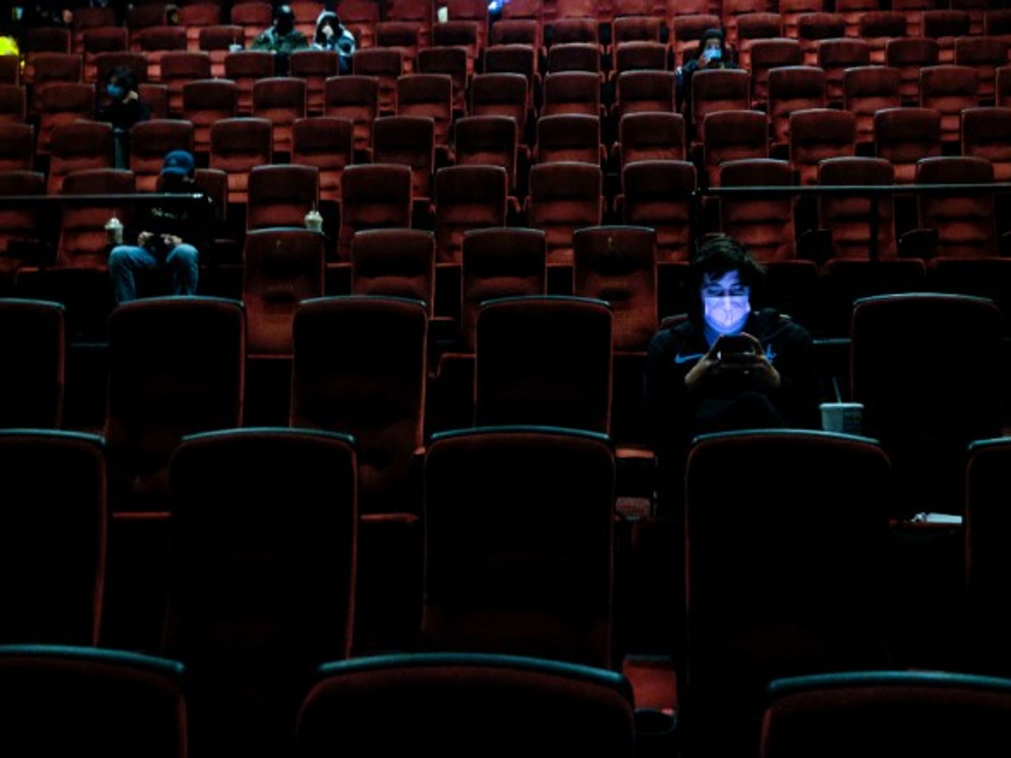 Moviegoers at the AMC Theater on the first day of reopening for theaters which had been closed due to the COVID-19 pandemic in Burbank, California