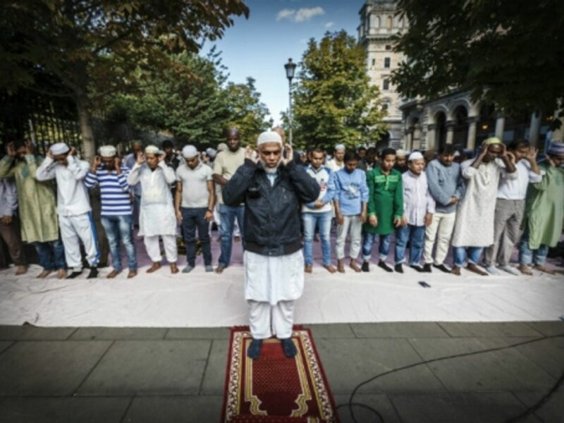Muslims devotees attend a morning street prayer in Rome